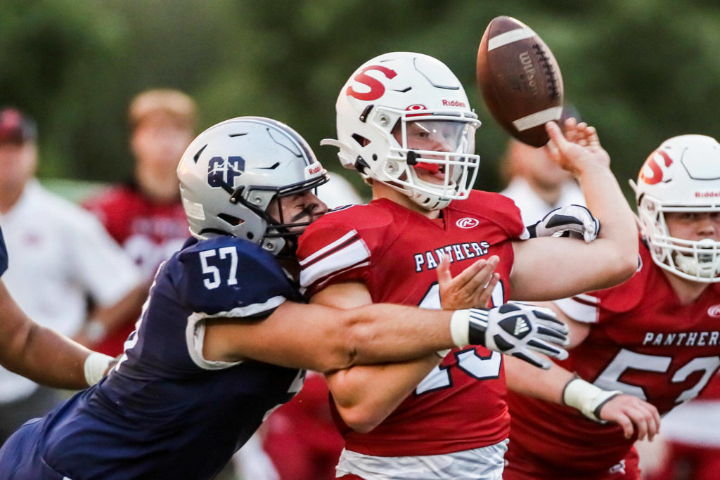 Glacier Peak’s Micah Harrelson forces an incomplete pass by Snohomish’s Kale Hammer Friday night at Snohomish High School in Snohomish, Washington on September 2, 2022. Glacier Peak led 28-0 at the half. (Kevin Clark / The Herald)
