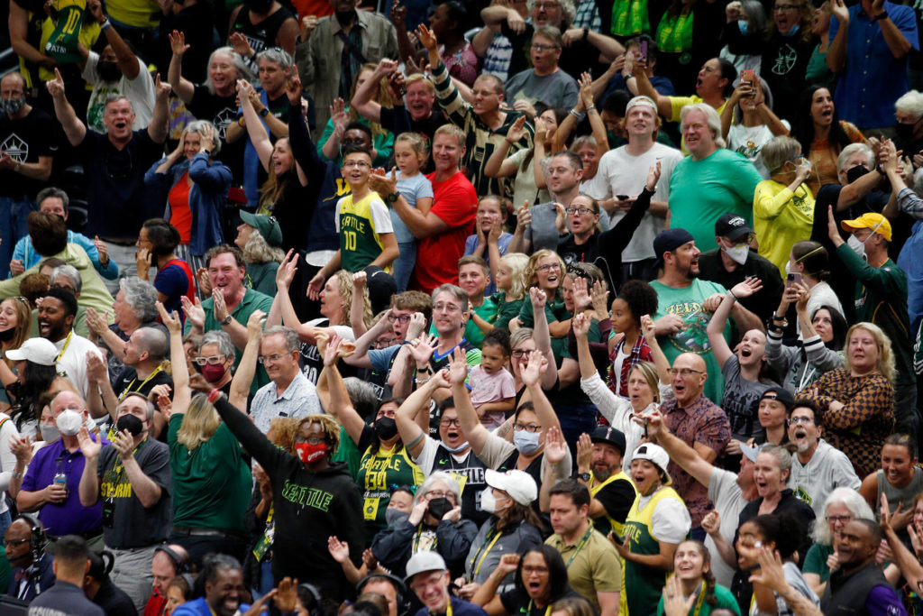Seattle Storm fans go wild after Sue Bird’s late heroics during a WNBA playoff game against the Las Vegas Aces on Sunday, Sep. 4, 2022, at Climate Pledge Arena in Seattle, Washington. (Ryan Berry / The Herald)
