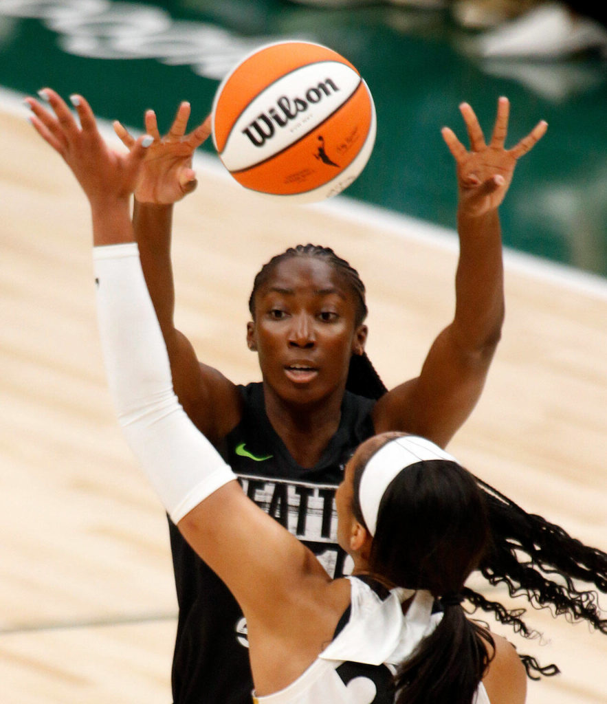 The Seattle Storm’s Ezi Magbegor passes to the paint during a WNBA playoff game against the Las Vegas Aces on Sunday, Sep. 4, 2022, at Climate Pledge Arena in Seattle, Washington. (Ryan Berry / The Herald)
