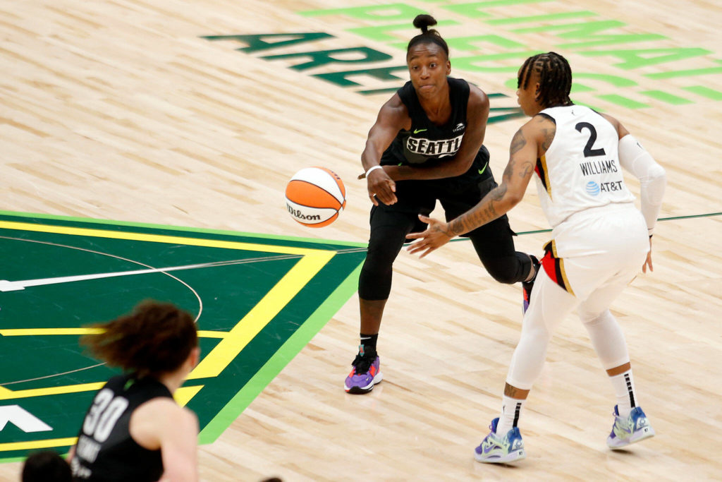 The Seattle Storm’s Jewell Loyd passes to the paint during a WNBA playoff game against the Las Vegas Aces on Sunday, Sep. 4, 2022, at Climate Pledge Arena in Seattle, Washington. (Ryan Berry / The Herald)
