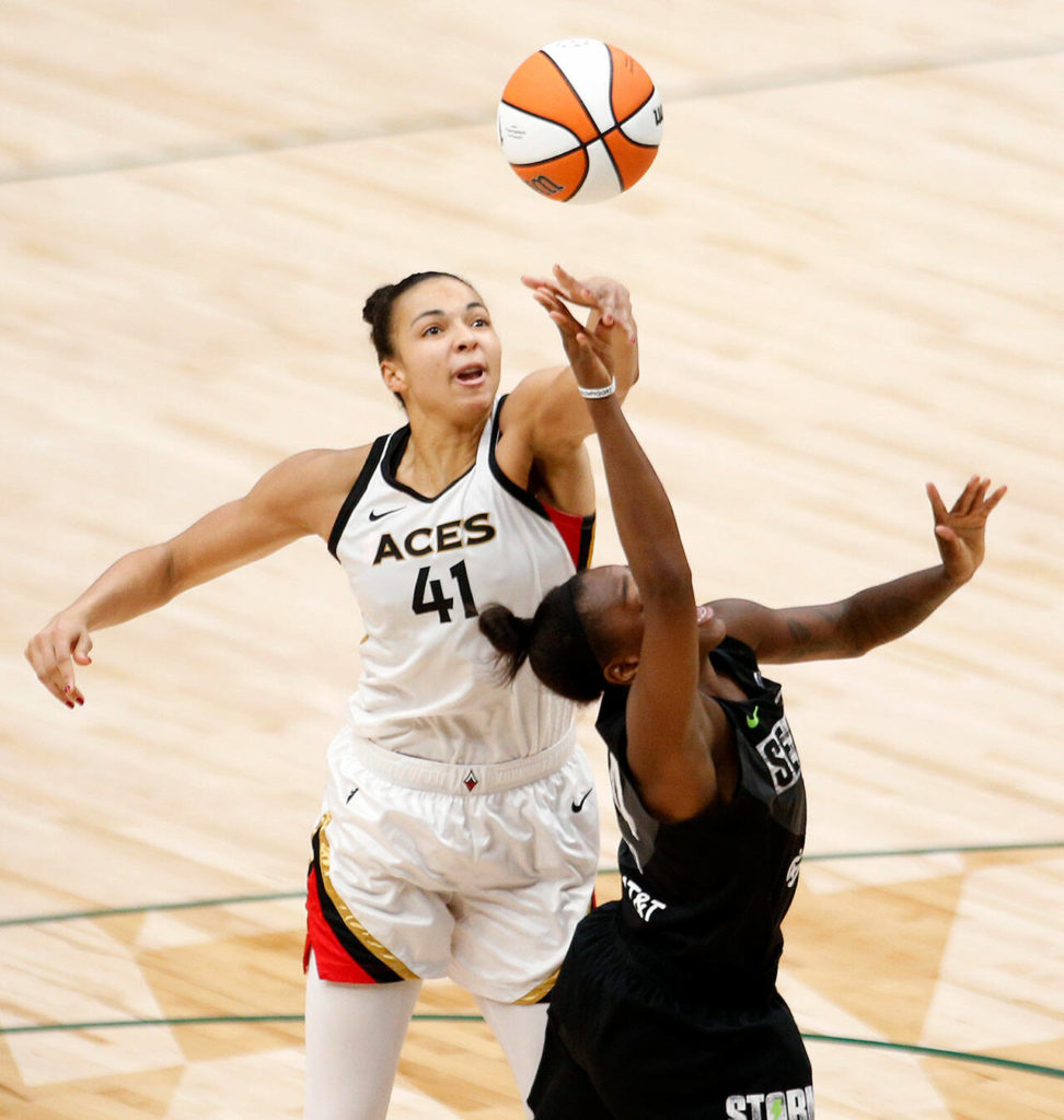 The Las Vegas Aces’ Kiah Stokes records a block during a WNBA playoff game against the Seattle Storm on Sunday, Sep. 4, 2022, at Climate Pledge Arena in Seattle, Washington. (Ryan Berry / The Herald)
