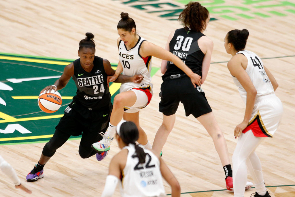 The Seattle Storm’s Jewell Loyd gets around a defender during a WNBA playoff game against the Las Vegas Aces on Sunday, Sep. 4, 2022, at Climate Pledge Arena in Seattle, Washington. (Ryan Berry / The Herald)
