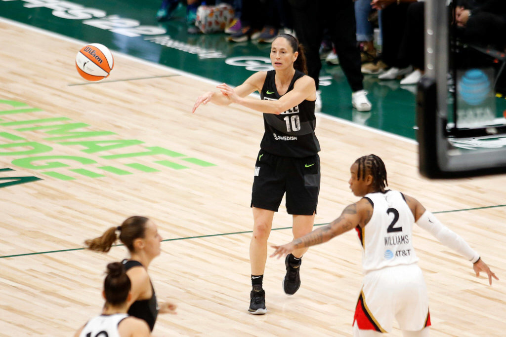 The Seattle Storm’s Sue Bird passes the ball during a WNBA playoff game against the Las Vegas Aces on Sunday, Sep. 4, 2022, at Climate Pledge Arena in Seattle, Washington. (Ryan Berry / The Herald)
