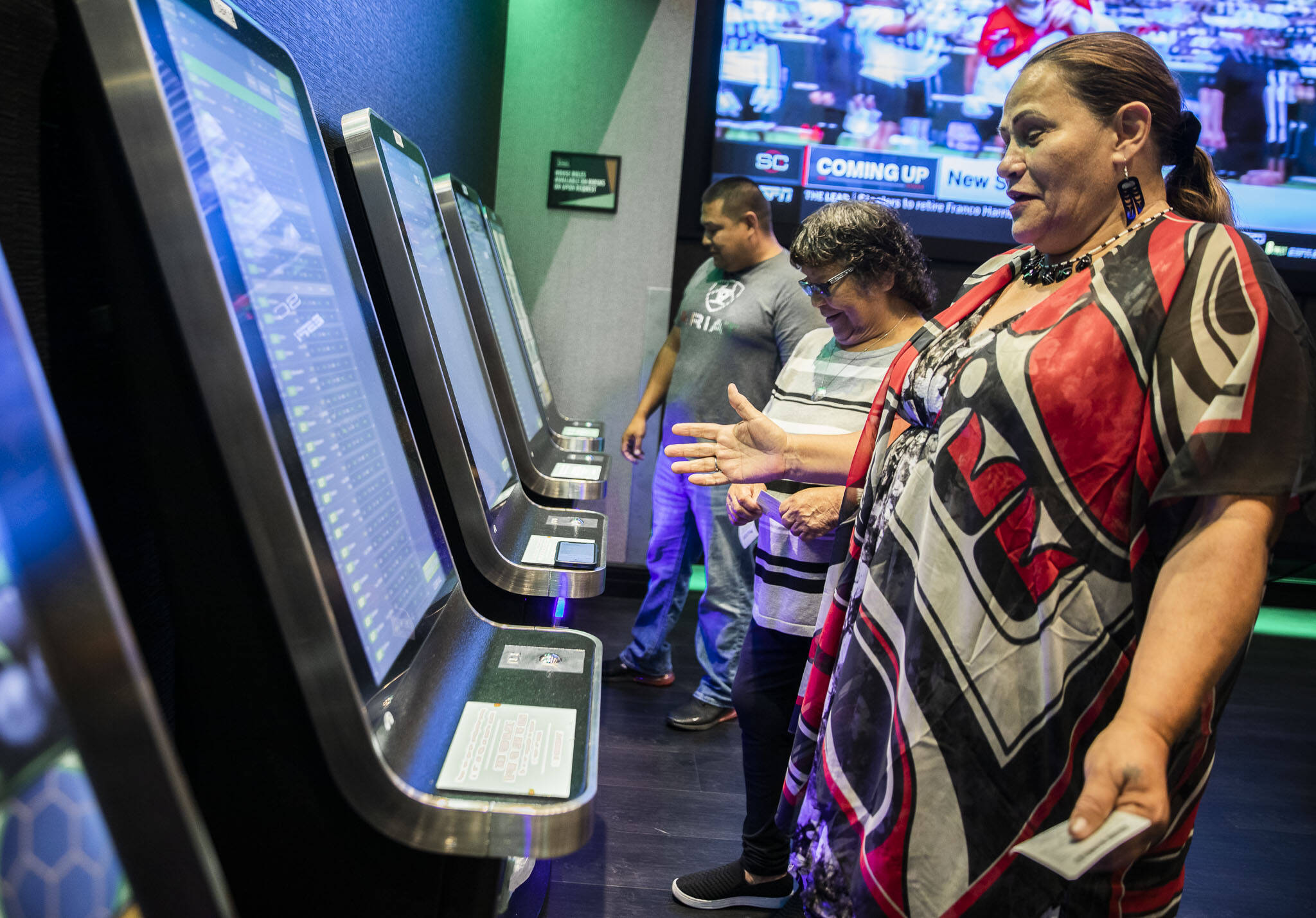 Tulalip Chairwoman Teri Gobin reacts after placing one of the first bets during the soft opening of the DraftKings Sportsbook at the Tulalip Casino on Tuesday, in Tulalip. (Olivia Vanni / The Herald)