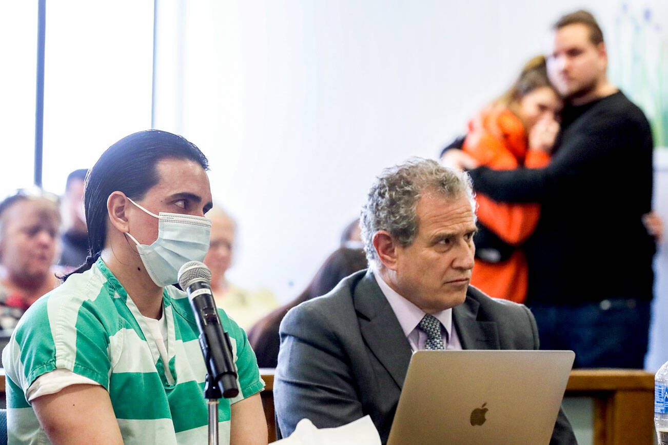 Homero Osuna Gonzalez, left, during his sentencing for the murder of his wife, Madison King, with her family and friends in the gallery on Monday, at the Snohomish County Courthouse in Everett. (Kevin Clark / The Herald)