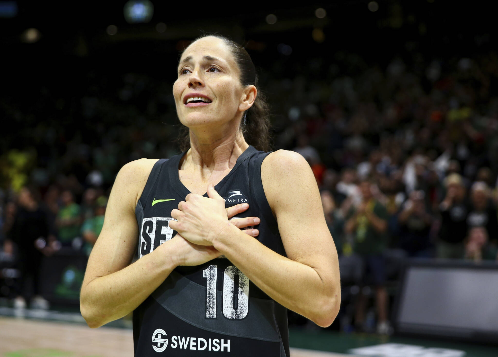 Storm guard Sue Bird reacts to fans chanting “Thank you Sue” after the Storm were eliminated from the playoffs with a loss in Game 4 of a playoff semifinal to the Las Vegas Aces on Tuesday in Seattle. (AP Photo/Lindsey Wasson)