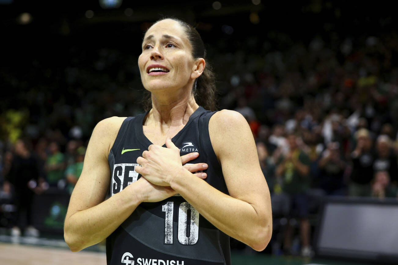 Seattle Storm guard Sue Bird reacts to fans chanting "Thank you Sue" after the Storm were eliminated from the playoffs with a loss in Game 4 of a WNBA basketball playoff semifinal to the Las Vegas Aces, Tuesday, Sept. 6, 2022, in Seattle. (AP Photo/Lindsey Wasson)