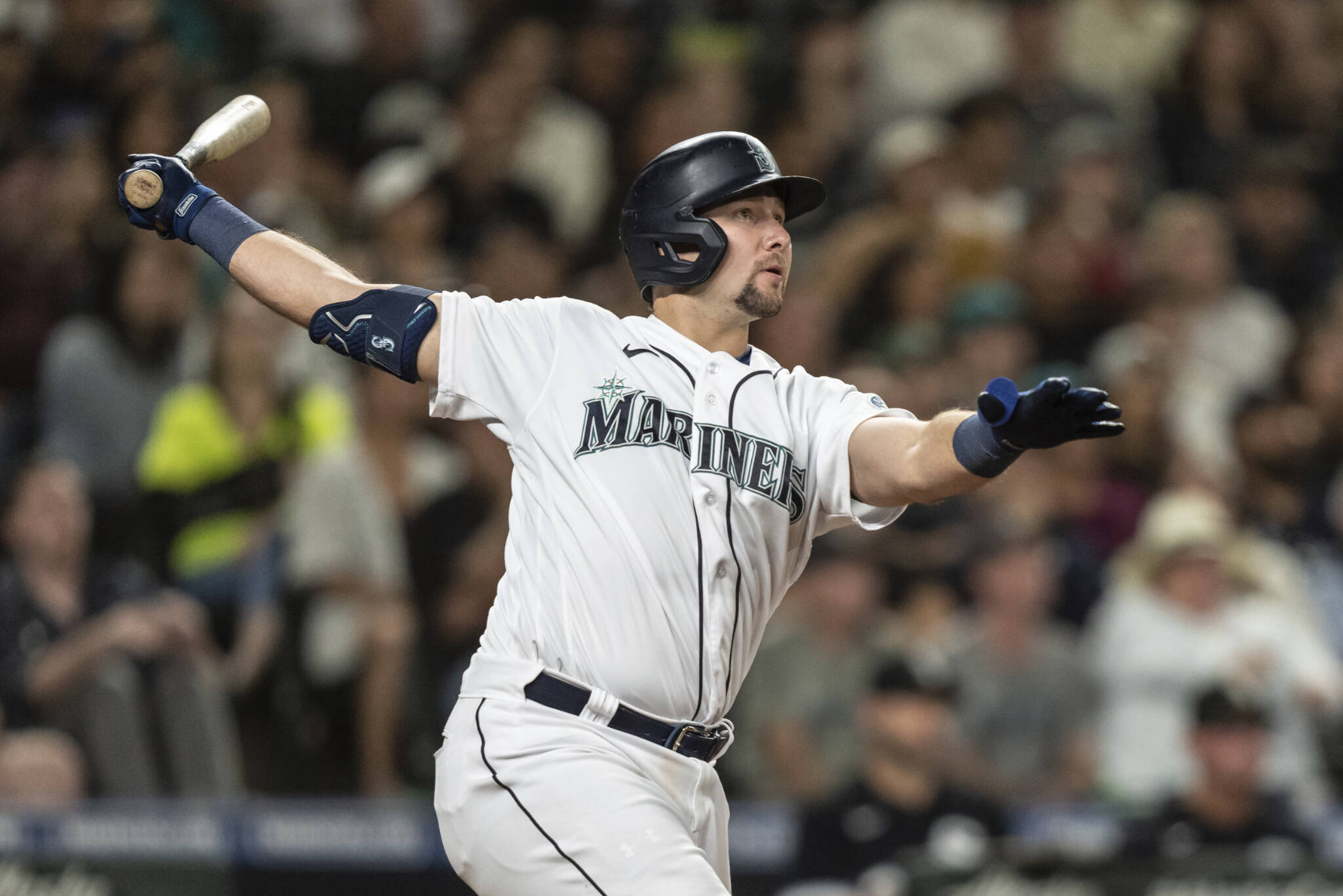 The Mariners’ Cal Raleigh watches his two-run home run off White Sox relief pitcher Reynaldo Lopez during the eighth inning of a game Tuesday in Seattle. (AP Photo/Stephen Brashear)