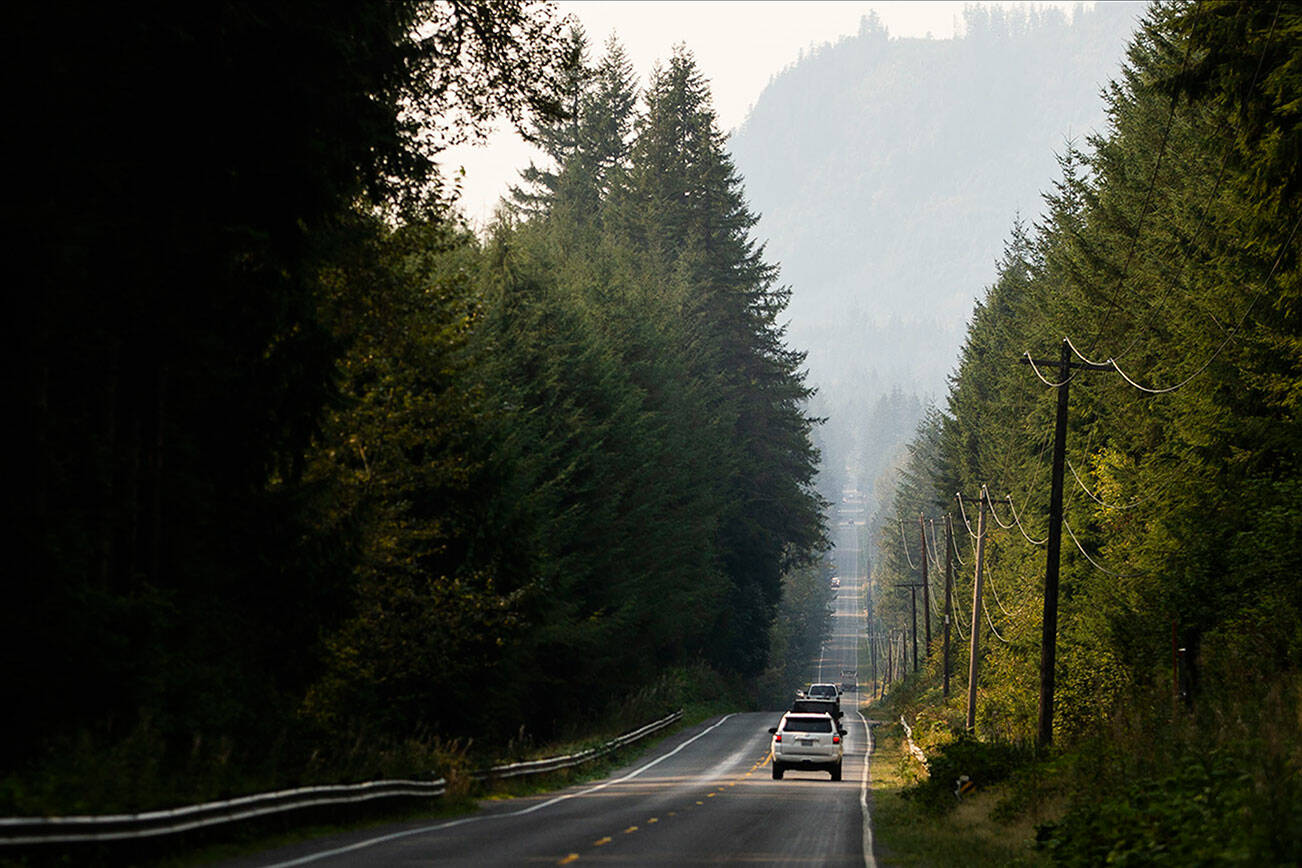 Cars drive along a smokey Mountain Loop Highway on Friday, Sept. 9, 2022 in Granite Falls, Washington. (Olivia Vanni / The Herald)