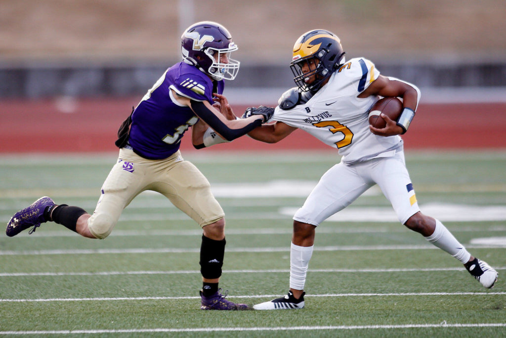 Lake Stevens’ David Brown swings the ball carrier to the ground for a tackle against Bellevue on Friday, Sep. 9, 2022, at Lake Stevens High School in Lake Stevens, Washington. (Ryan Berry / The Herald)
