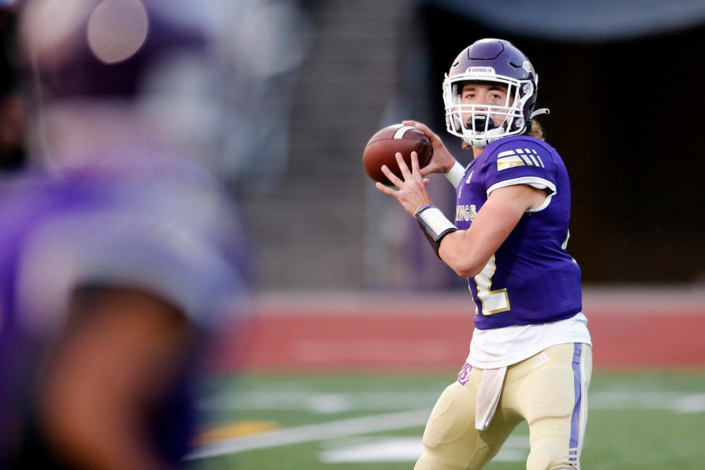 Lake Stevens’ Kolton Matson turns to throw a wide receiver screen against Bellevue on Friday, Sep. 9, 2022, at Lake Stevens High School in Lake Stevens, Washington. (Ryan Berry / The Herald)
