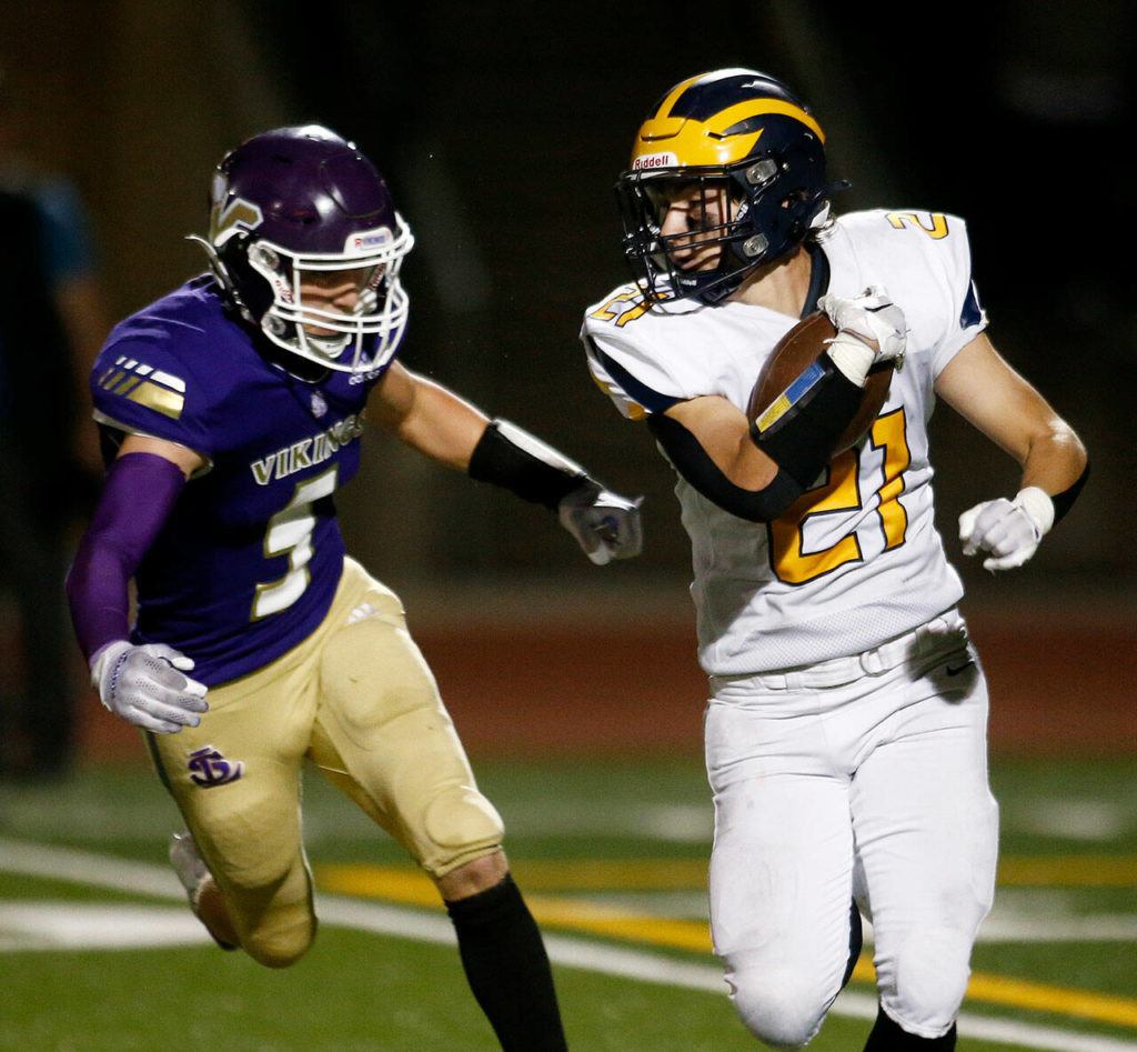 Bellevue’s Joel Schneider tries to evade a defender on a kick return against Lake Stevens on Friday, Sep. 9, 2022, at Lake Stevens High School in Lake Stevens, Washington. (Ryan Berry / The Herald)
