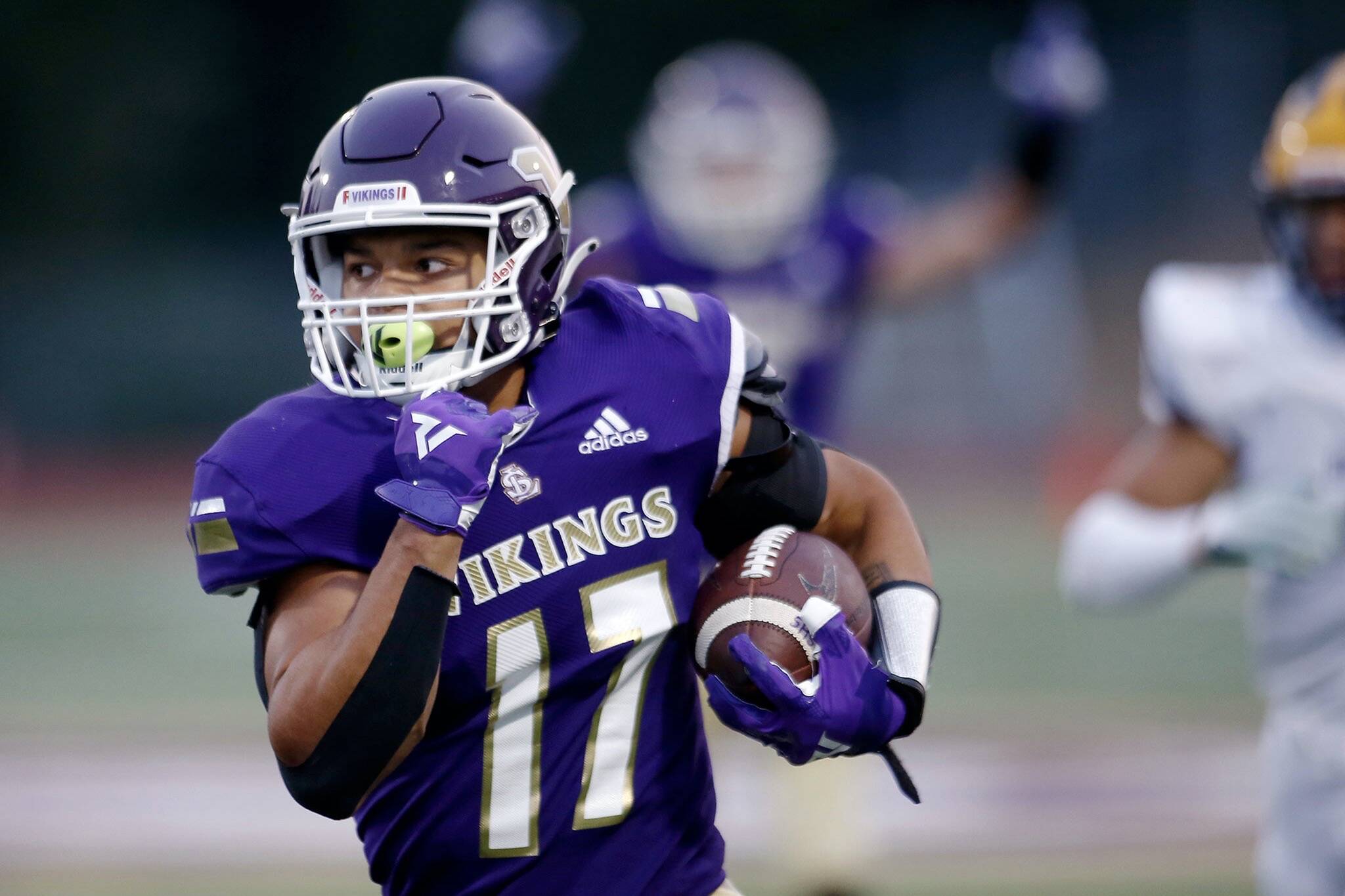 Lake Stevens’ Jayden Limar bursts down the sideline before diving for the pylon on a long touchdown run against Bellevue on Friday, Sep. 9, 2022, at Lake Stevens High School in Lake Stevens, Washington. (Ryan Berry / The Herald)