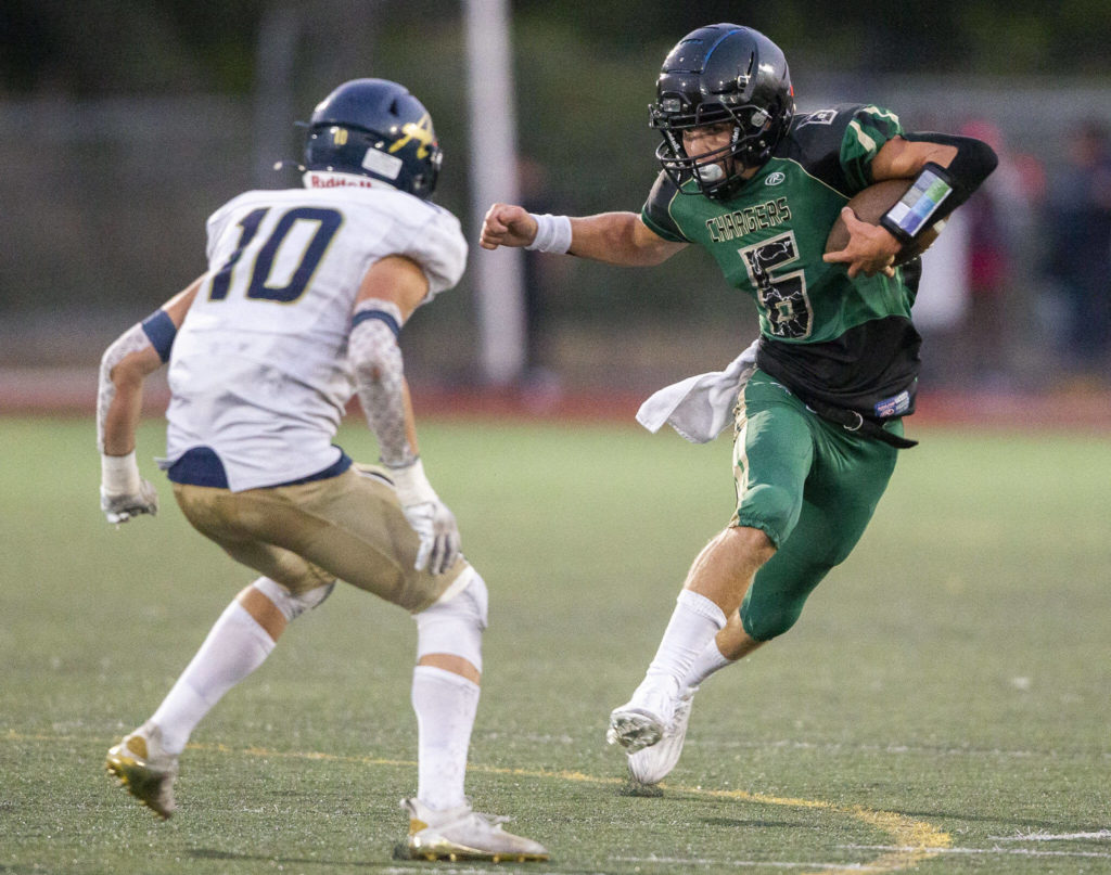 Marysville Getchell’s Carter Schmidt runs the ball during the game Arlington on Friday, Sept. 9, 2022 in Marysville, Washington. (Olivia Vanni / The Herald)

