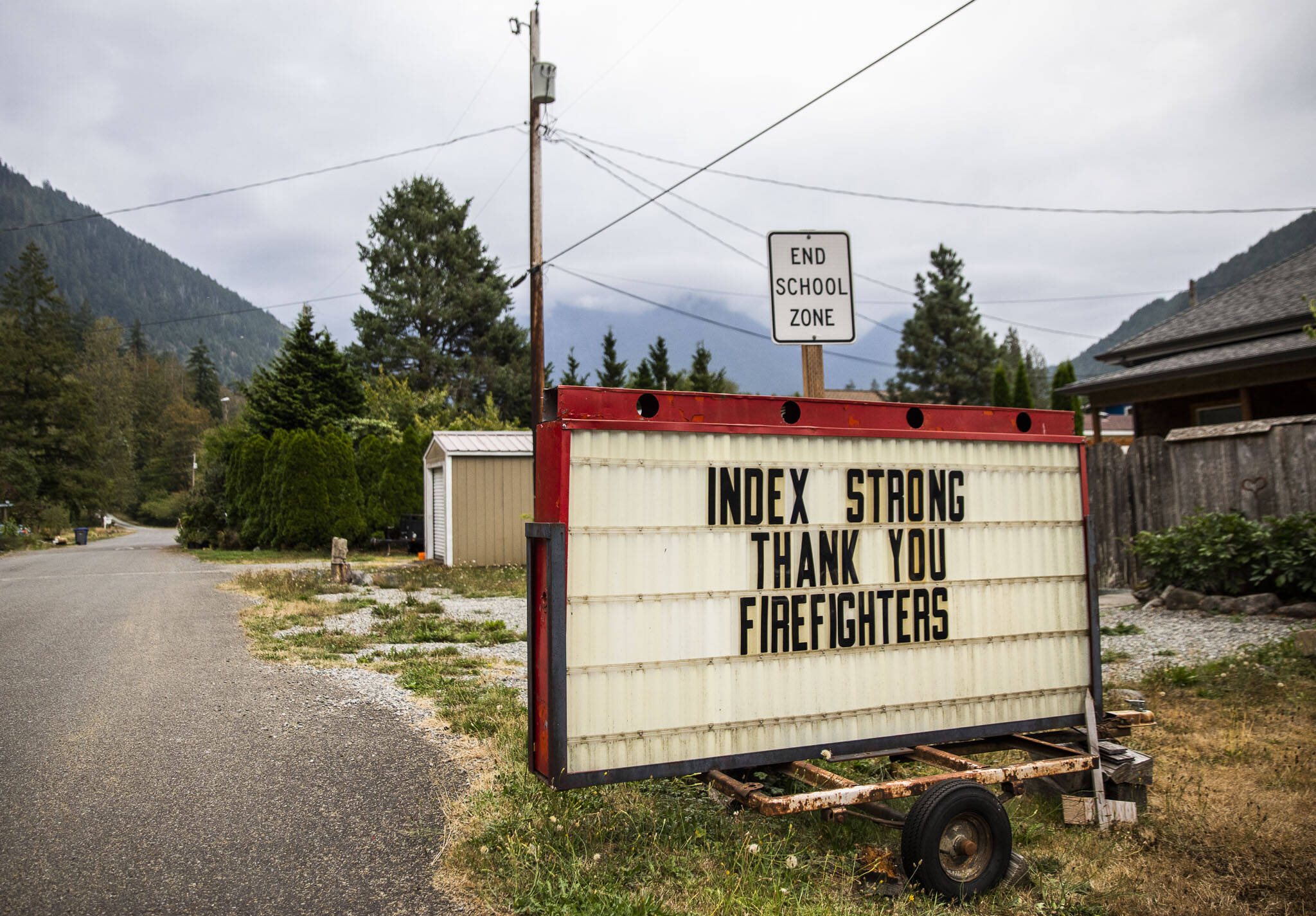 A sign thanking firefighters is displayed along an empty Index Avenue on Tuesday, Sept. 13, 2022 in Index, Washington. (Olivia Vanni / The Herald)