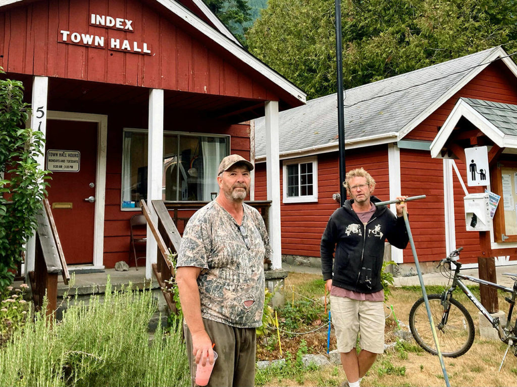 Index mayor Norm Johnson (left) and town maintenance man Sean “Rib” Horst stand in front of the Index Town Hall on Tuesday, Sept. 13, 2022. (Ellen Dennis / The Herald)