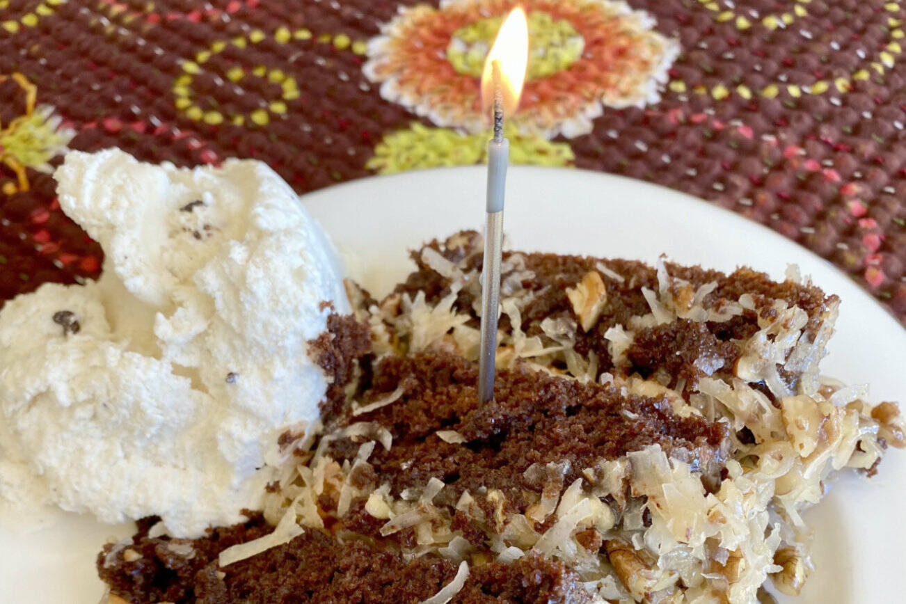 This German chocolate cake is rich and decadent and looks beautiful with a sparkling candle on top. (Photo by Tressa Dale/Peninsula Clarion)