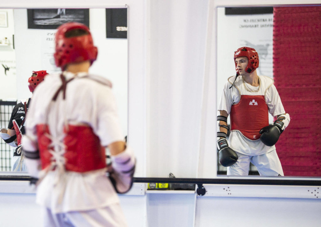 Ivan Sokolenko spars during class at Master JI’s TaeKwonDo Martial Arts School on Thursday, Sept. 8, 2022 in Monroe, Washington. (Olivia Vanni / The Herald)
