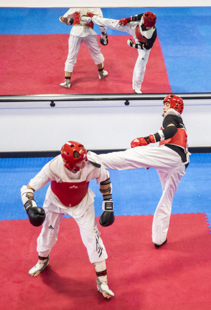 Ivan Sokolenko, left and brother Peter Sokolenko spar during class at Master JI’s TaeKwonDo Martial Arts School on Thursday, Sept. 8, 2022 in Monroe, Washington. (Olivia Vanni / The Herald)
