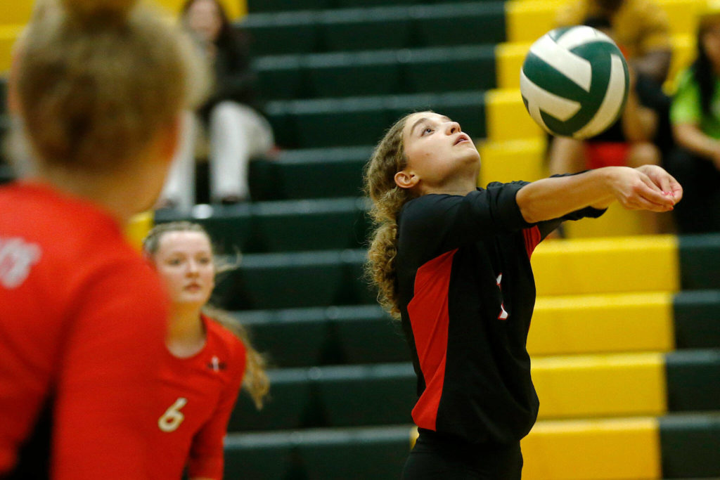 Archbishop Murphy’s Lauren Fogliani plays the serve against Shorecrest on Wednesday, Sep. 14, 2022, at Shorecrest High School in Shoreline, Washington. (Ryan Berry / The Herald)
