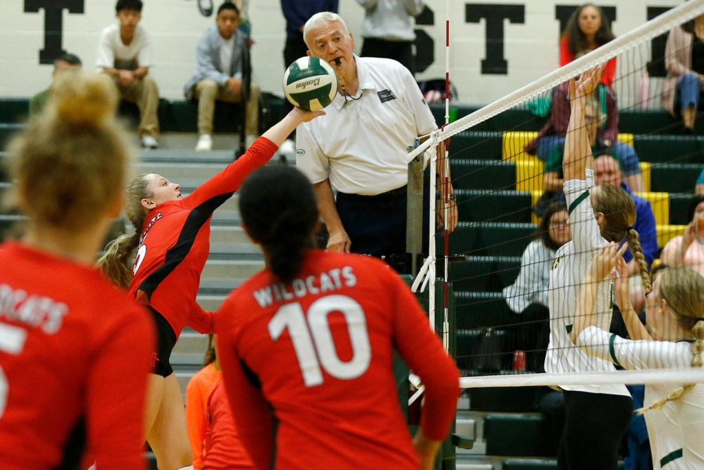 Archbishop Murphy’s Tatum Gill tries to finesse the ball over the net against Shorecrest on Wednesday, Sep. 14, 2022, at Shorecrest High School in Shoreline, Washington. (Ryan Berry / The Herald)
