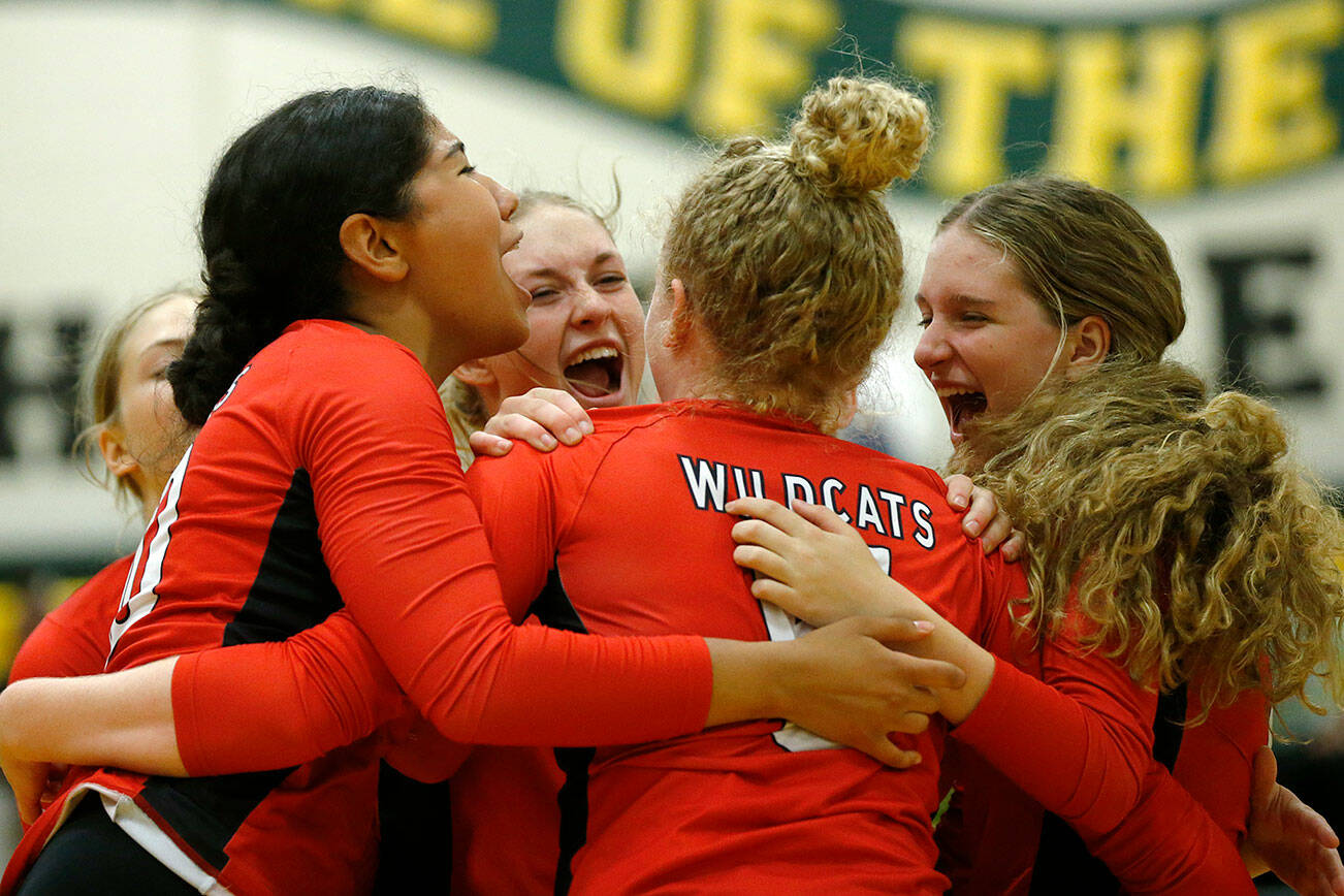 Archbishop Murphy celebrates after taking a late lead in the first set against Shorecrest on Wednesday, Sep. 14, 2022, at Shorecrest High School in Shoreline, Washington. (Ryan Berry / The Herald)