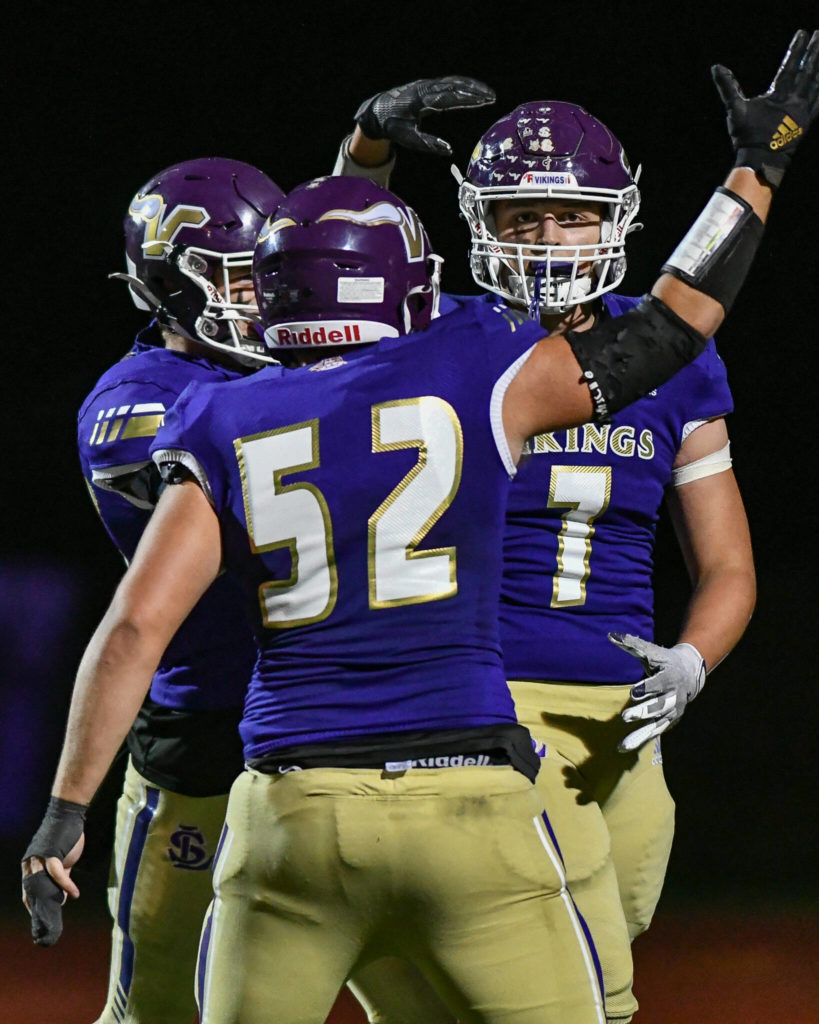Lake Stevens’ Joe McGinnis (7) celebrates with Bryce Slezak (52) during a game against Federal Way on Friday, Sept. 16, 2022, at Lake Stevens High School. (John Gardner / Pro Action Image)
