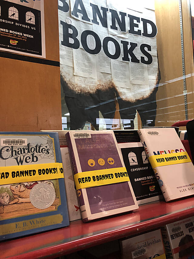 A display at the Everett Public Library’s downtown branch shows books that have been banned or removed from shelves at other public and school libraries in the country over the years (Jon Bauer / The Herald)