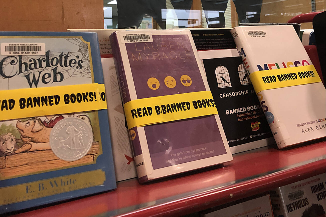 A display at the Everett Public Library's downtown branch shows books that have been banned or removed from shelves at other public and school libraries in the country over the years (Jon Bauer / The Herald)