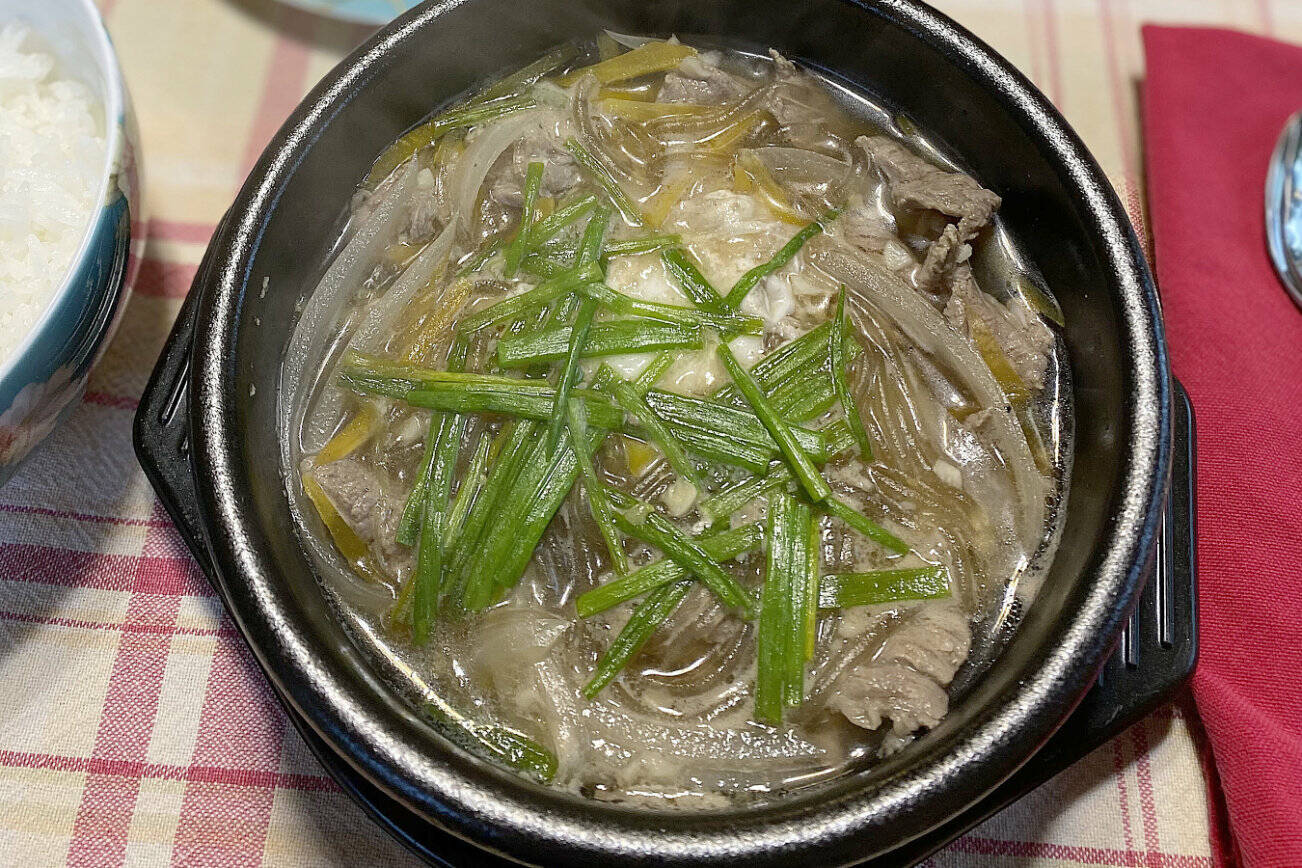 Bulkogi Stew, a mixture of beef steak, potato starch noodles, green onions and broth, is enjoyed as part of the Korean harvest festival, Chuseok. (Photo by Tressa Dale/Peninsula Clarion)