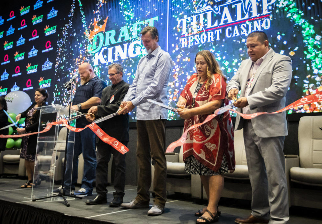 Tulalip board members, along with Randy Johnson and Johnny Avello cut a ribbon at the Tulalip DraftKings Sportsbook grand opening on Tuesday, in Tulalip. (Olivia Vanni / The Herald)
