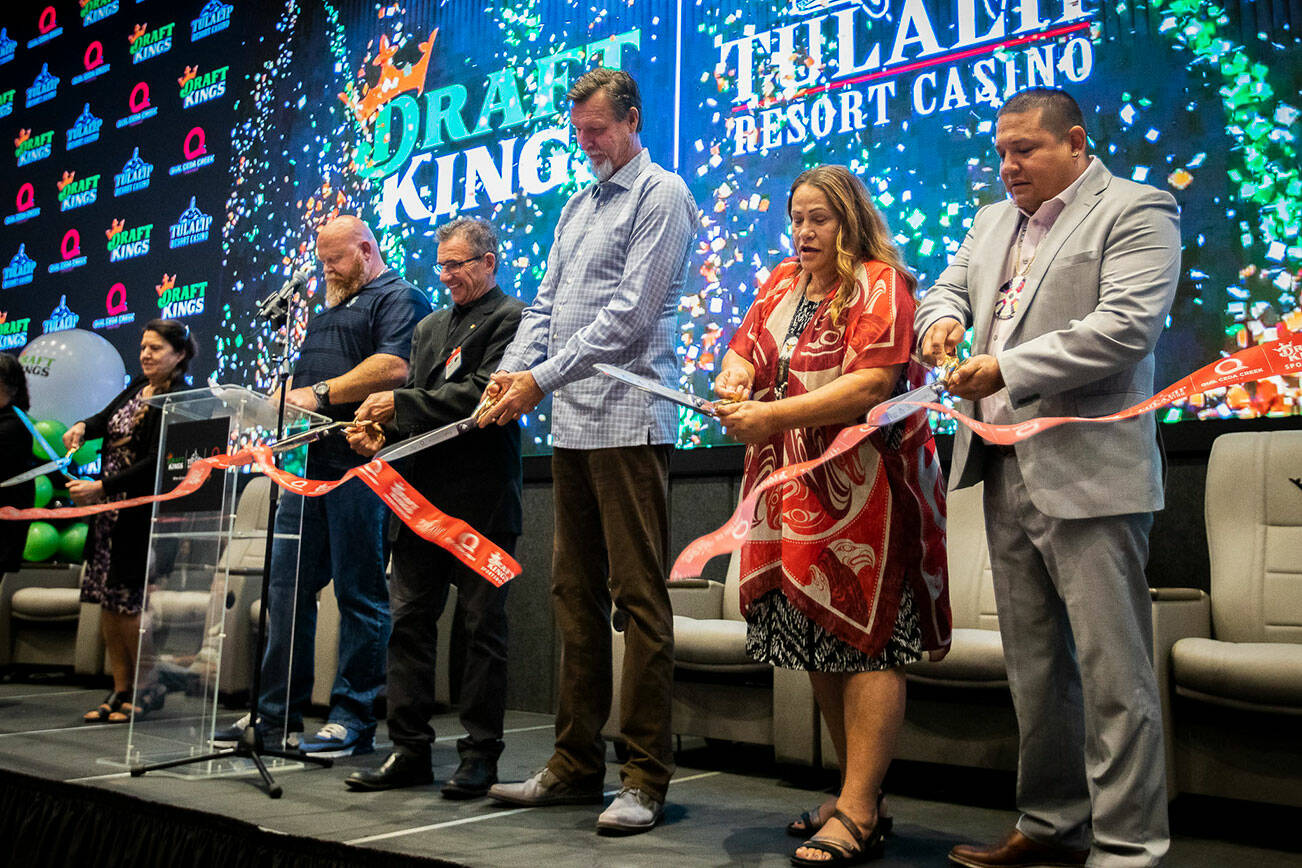 Tulalip board members, along with Randy Johnson and Johnny Avello cut a ribbon at the Tulalip DraftKings Sportsbook grand opening on Tuesday, Sept. 20, 2022 in Tulalip, Washington. (Olivia Vanni / The Herald)