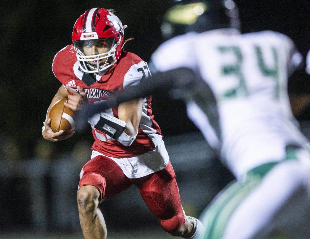 Marysville Pilchuck’s Joseph Davis runs the ball during the game against Marysville Getchell on Friday, Sept. 16, 2022 in Marysville, Washington. (Olivia Vanni / The Herald)
