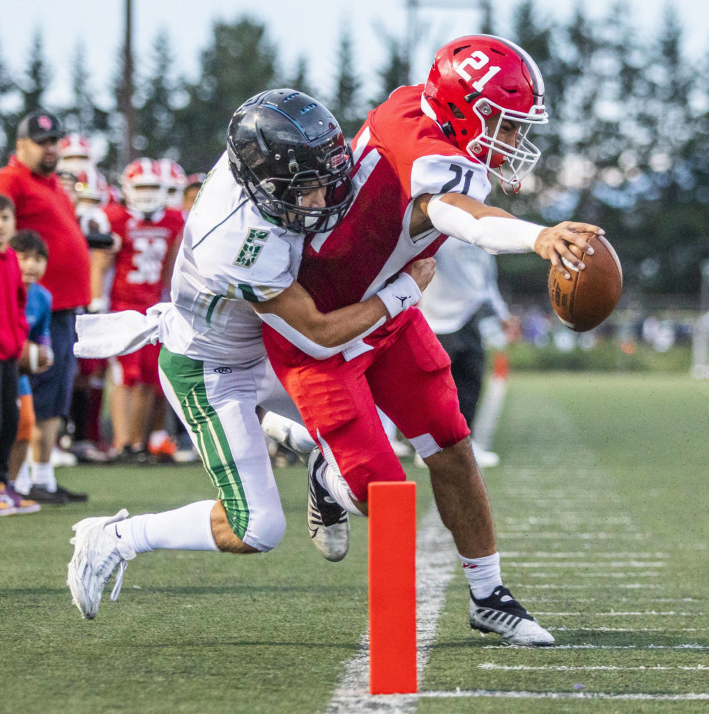 Marysville Pilchuck’s Kenai Sinaphet reaches out to try and cross into the end zone for a touchdown during the game against Maryville Getchell on Friday, Sept. 16, 2022 in Marysville, Washington. (Olivia Vanni / The Herald)
