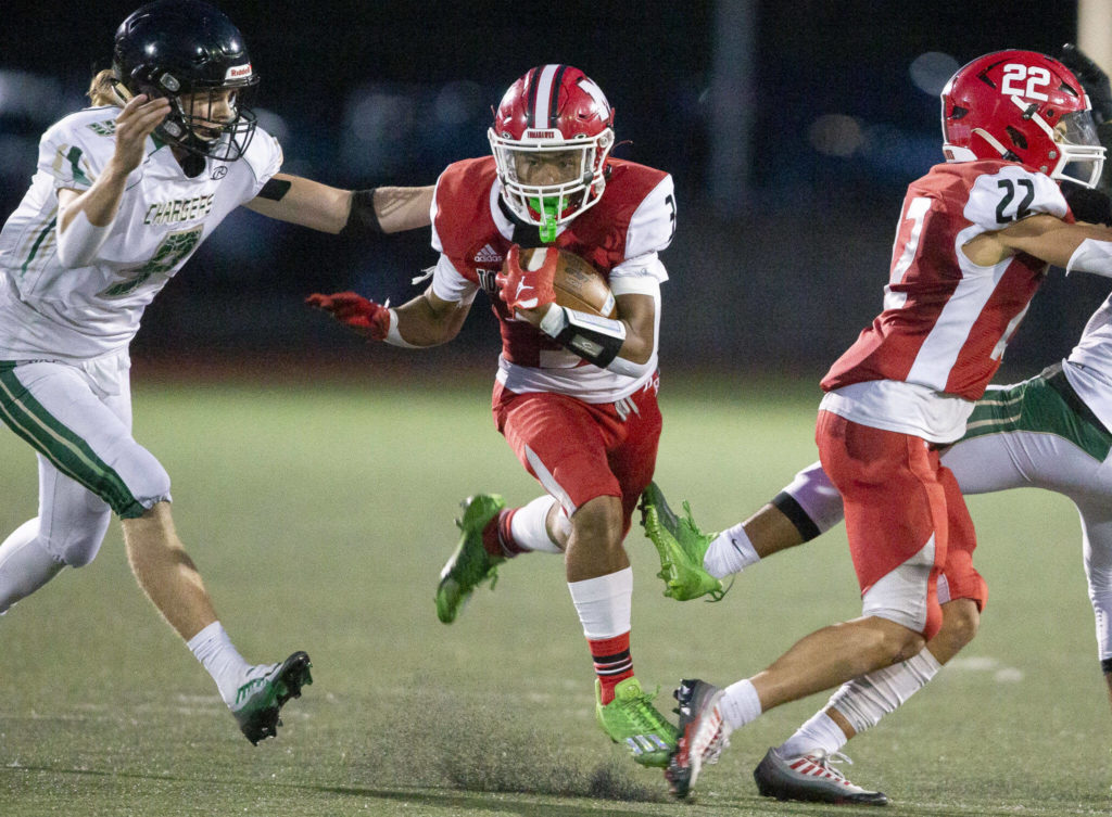 Marysville Pilchuck’s Gaylan Gray runs the ball during the game against Marysville Getchell on Friday, Sept. 16, 2022 in Marysville, Washington. (Olivia Vanni / The Herald)
