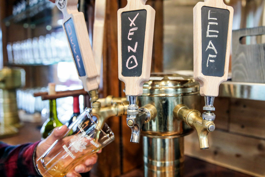 Handwritten labels pulls at the newly opened Peace of Mind Brewing on Sept. 13, in Lynnwood. (Kevin Clark / The Herald)
