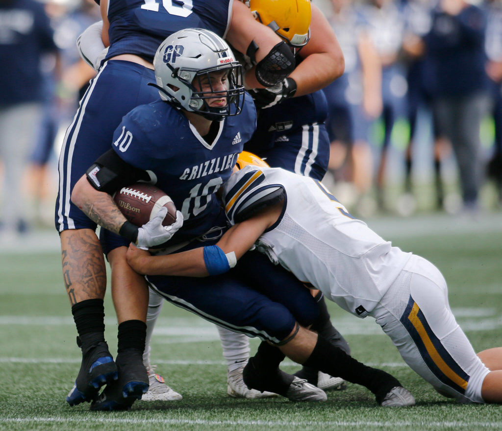 Glacier Peak’s Ryan King gets hit and brought to the ground against Ferndale on Saturday, Sep. 17, 2022, at Lumen Field in Seattle, Washington. (Ryan Berry / The Herald)
