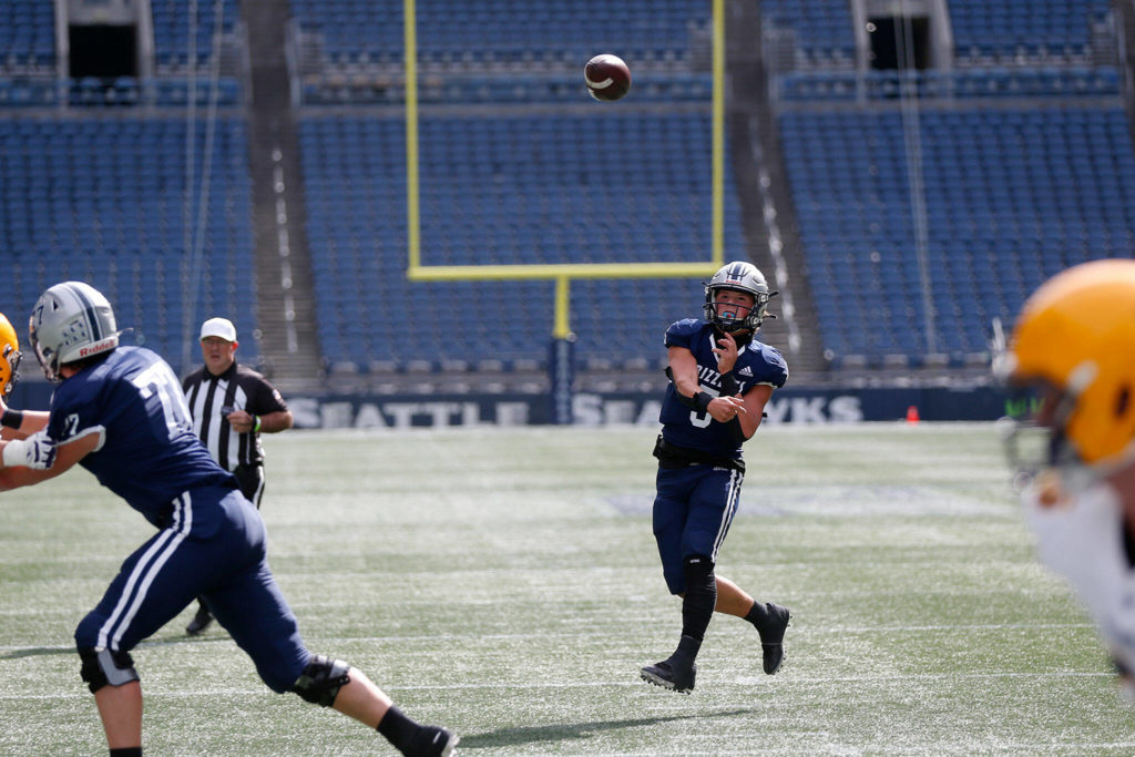 Glacier Peak’s River Lein tosses a first quarter touchdown against Ferndale on Saturday, Sep. 17, 2022, at Lumen Field in Seattle, Washington. (Ryan Berry / The Herald)
