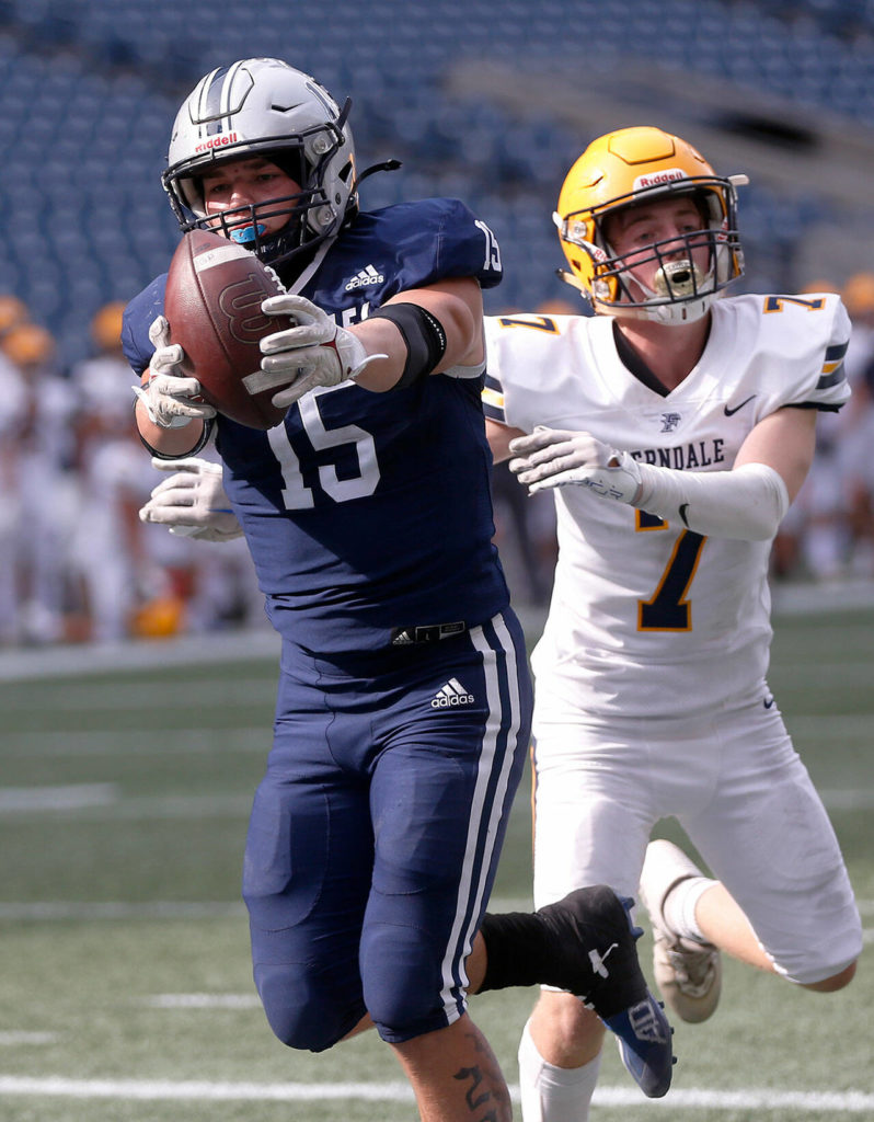 Glacier Peak’s Trey Leckner beats a defender to the goal line as he reaches out for a touchdown against Ferndale on Saturday, Sep. 17, 2022, at Lumen Field in Seattle, Washington. (Ryan Berry / The Herald)
