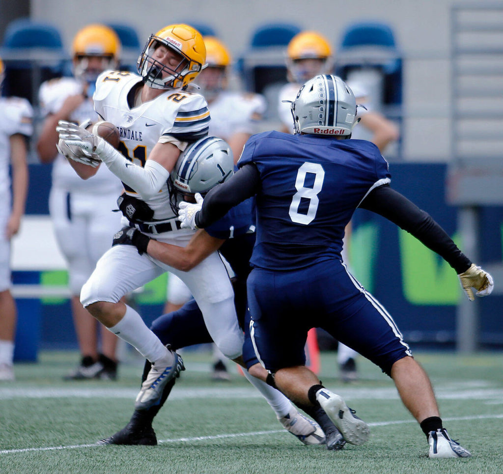 Ferndale’s Aydin O’Tool gets hit hard but holds onto a reception against Glacier Peak on Saturday, Sep. 17, 2022, at Lumen Field in Seattle, Washington. (Ryan Berry / The Herald)
