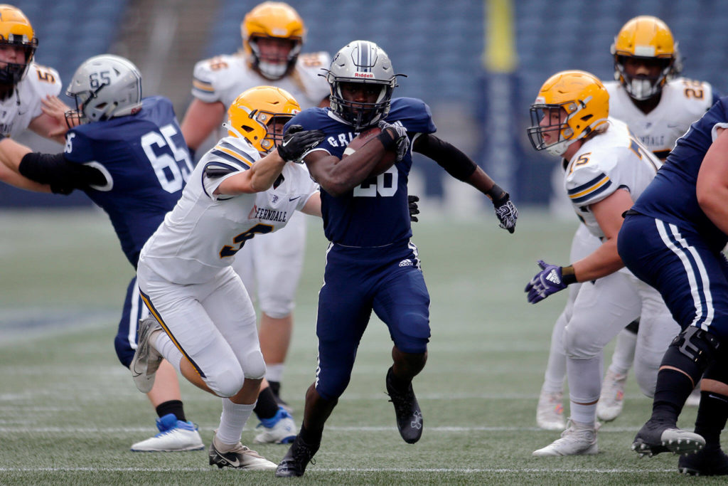 Glacier Peak’s Chrisvin Bonshe nearly takes a carry into the secondary before getting pulled down by the jersey against Ferndale on Saturday, Sep. 17, 2022, at Lumen Field in Seattle, Washington. (Ryan Berry / The Herald)
