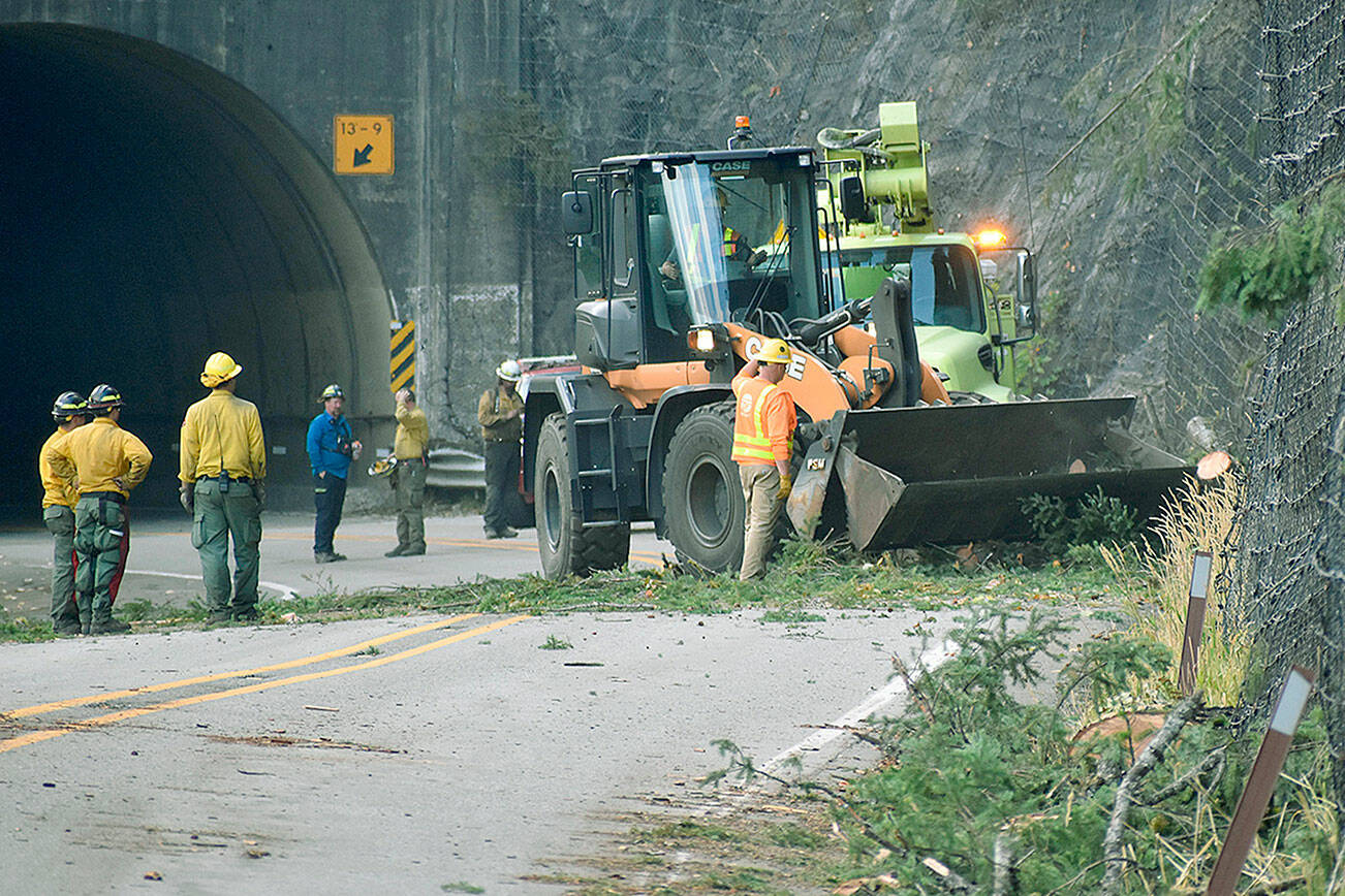 Crews work to clear debris from U.S. 2 on Saturday, Sept. 16, 2022 after the Bolt Creek fire destabilized the steep terrain. (Lauren Bonney, PIO NW team 8)