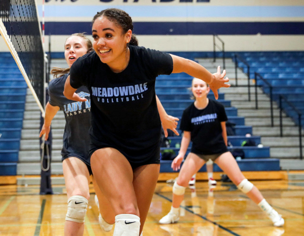 Tanna Kollen gathers for block during practice Monday afternoon at Meadowdale High School in Lynnwood, Washington on September 19, 2022. (Kevin Clark / The Herald)
