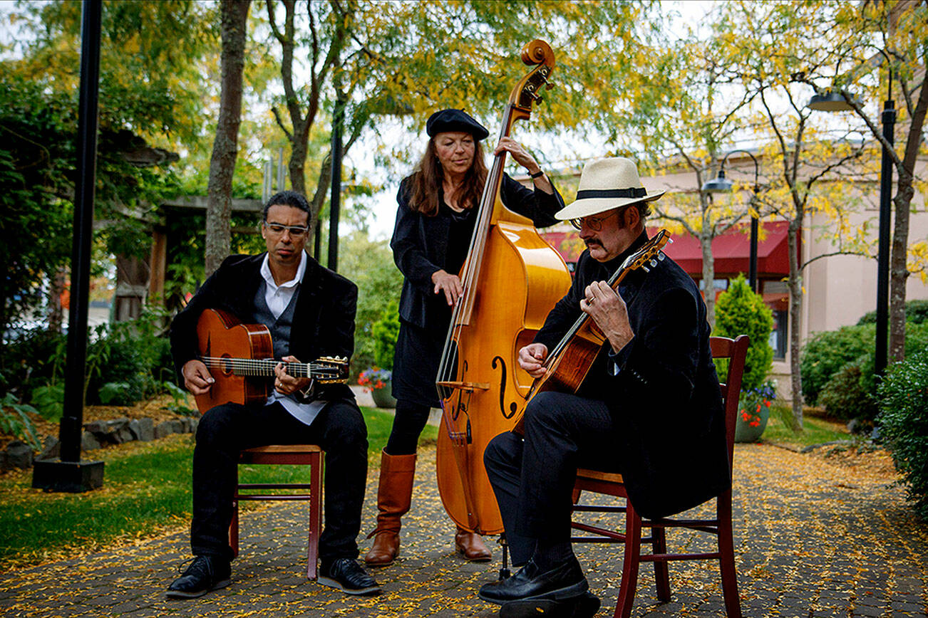 From left to right: Troy Chapman, Kristi O’Donnell and Keith Bowers are three of five members of the Hot Club of Troy. The band is the opening act at DjangoFest Northwest. (David Welton)