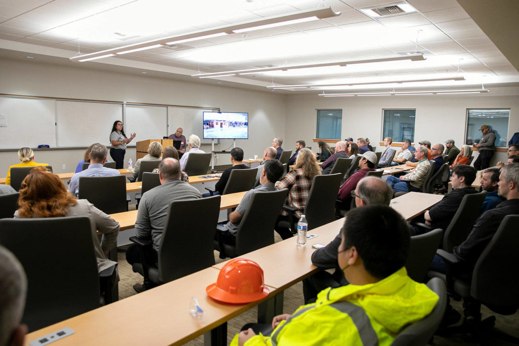 Marianna Talbott from NWCI gives an update on the institute’s programs during a segment of the grand opening of the Northwest Carpenters Institute’s new building on Thursday, in Burlington. (Ryan Berry / The Herald)
