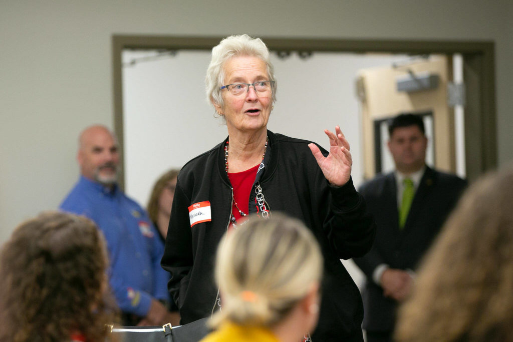 Melinda Nichols, the first pre-apprenticed carpenter ever in the state of Washington, is recognized by a large audience during the grand opening of the Northwest Carpenters Institute’s new building on Thursday, in Burlington. (Ryan Berry / The Herald)
