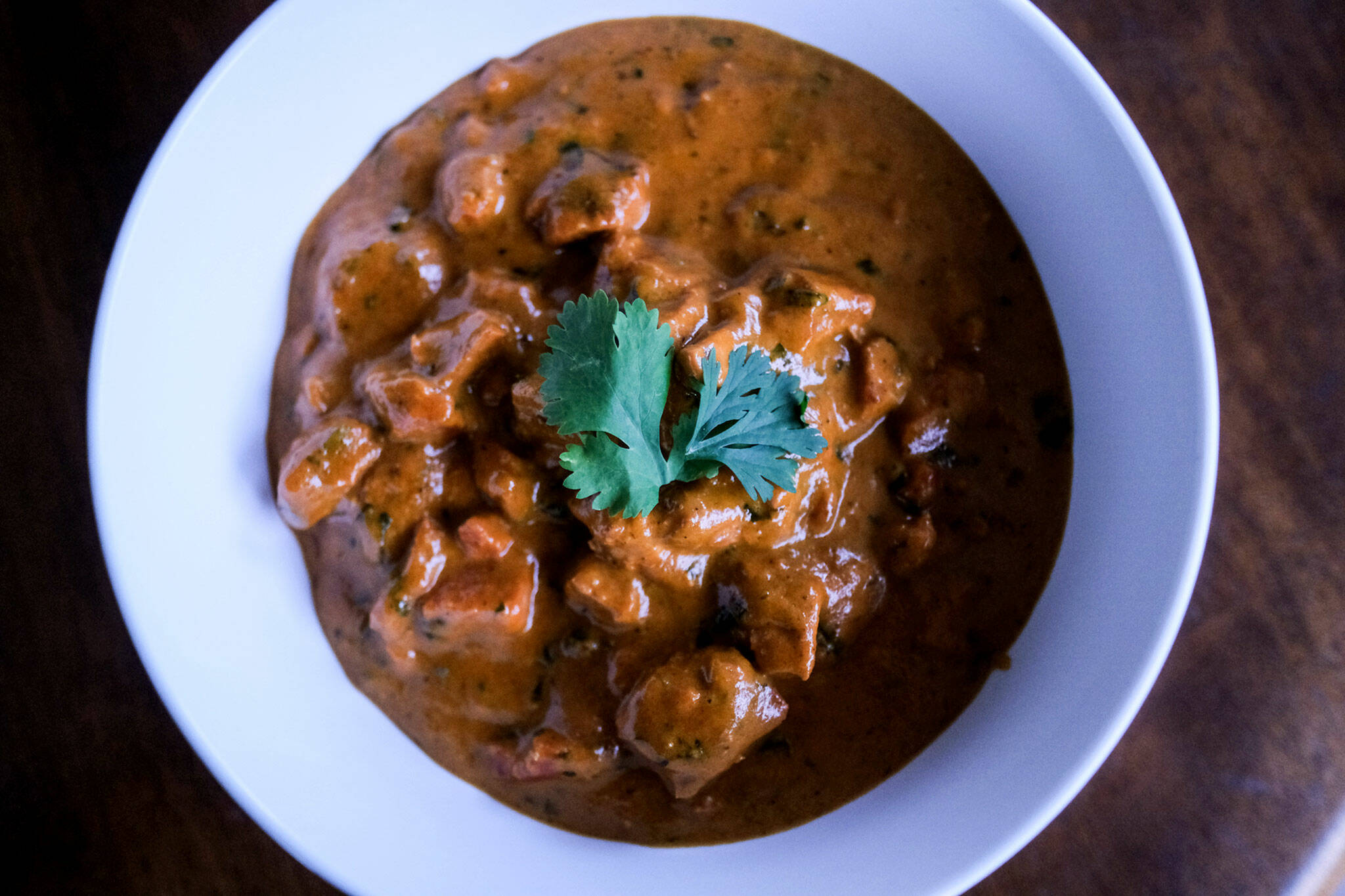 The butter chicken at 5 Rivers Indian Cuisine in Everett is a bestseller. (Taylor Goebel / The Herald)