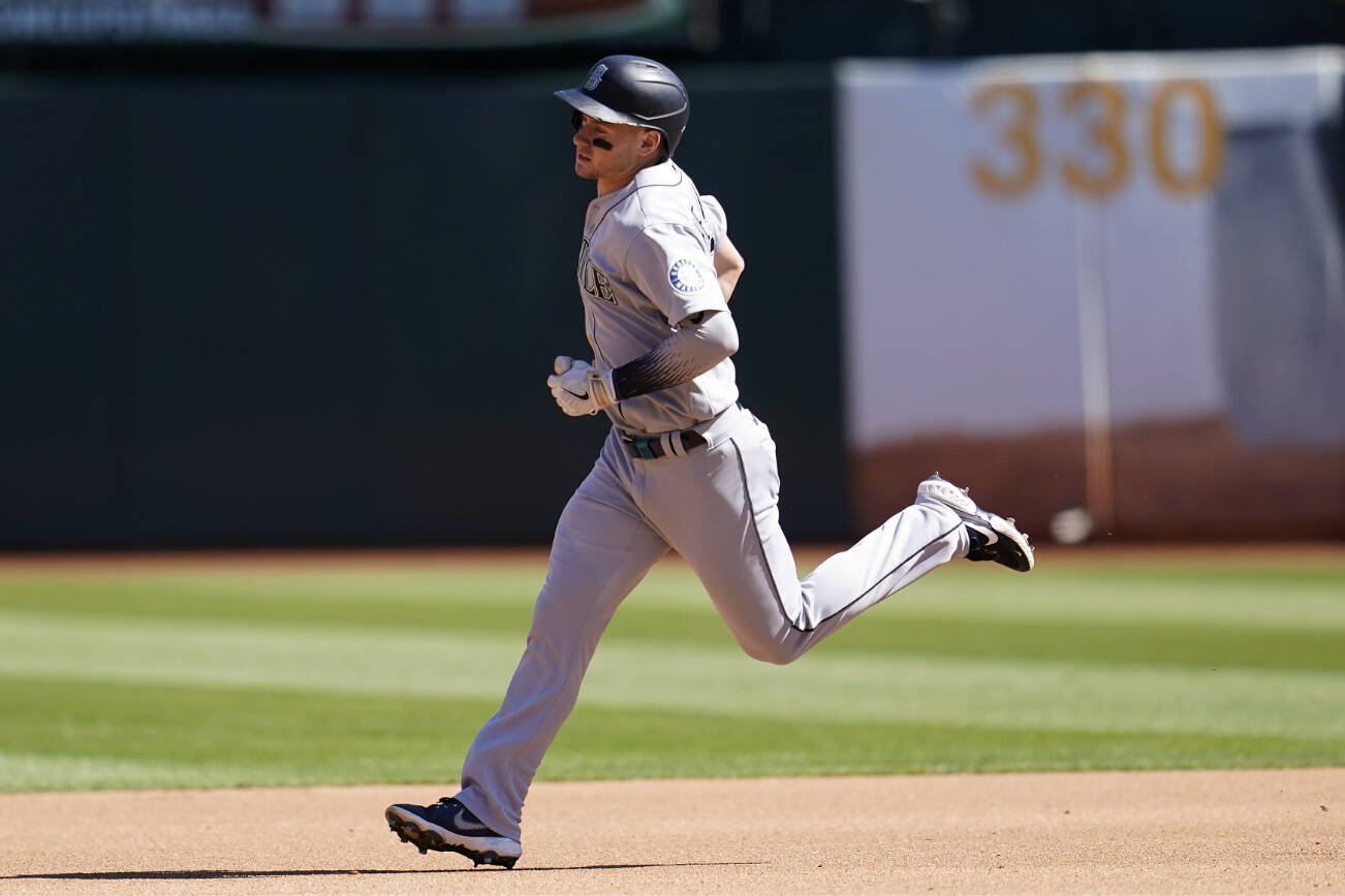 Seattle Mariners' Jarred Kelenic rounds the bases after hitting a home run during the fourth inning of a baseball game against the Oakland Athletics in Oakland, Calif., Thursday, Sept. 22, 2022. (AP Photo/Jeff Chiu)