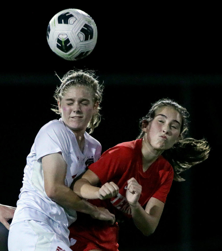 Archbishop Murphy’s Georgia Franck, left, and Mountlake Terrace’s Claire August vie for control of the ball Thursday night at Lynnwood High School in Lynnwood, Washington on September 22, 2022. The Hawks and Wildcats finished the match with 1-1 tie. (Kevin Clark / The Herald)
