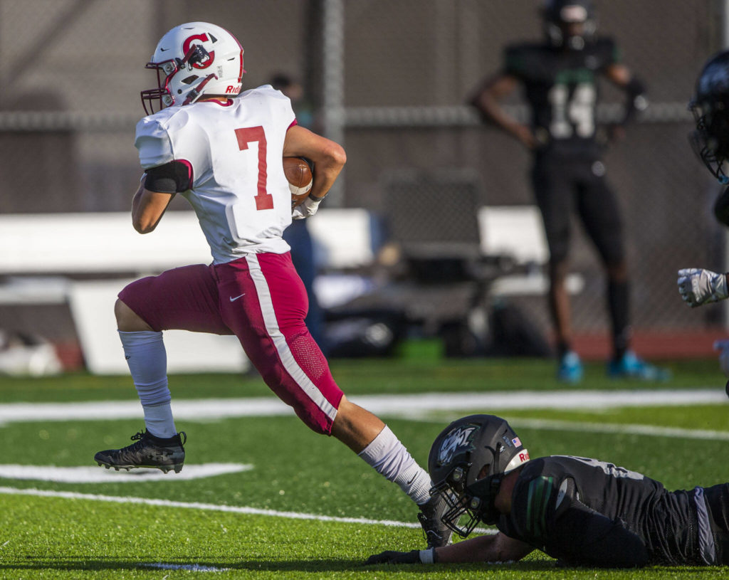 Cascade’s Zach Lopez escapes a tackle during the game against Jackson on Friday, Sept. 23, 2022 in Everett, Washington. (Olivia Vanni / The Herald)
